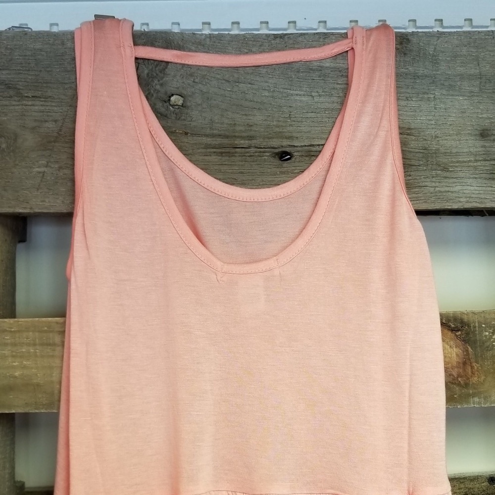 Peach ruffled tank top.